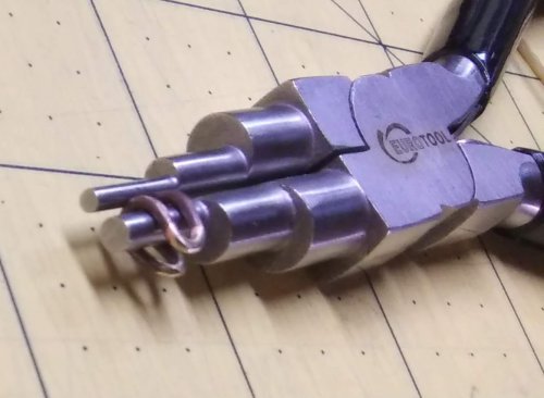 Judy Larson's Simple Bail on a Coin Pendant - , Findings & Components, Toggles & Clasps, Earwire & Headpin, Butane Torch, Soldering, Solder, Bend the oval jump ring around